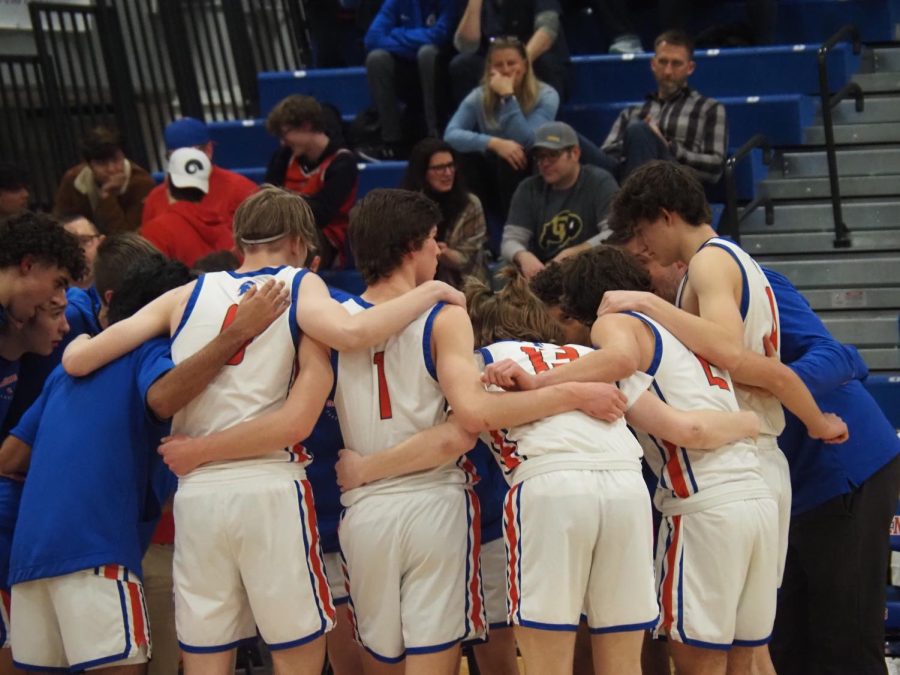 Warriors in a huddle before their game against  Holy family. 