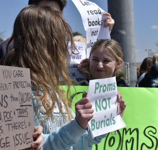Students hold signs during the April 5th walkout against gun violence.