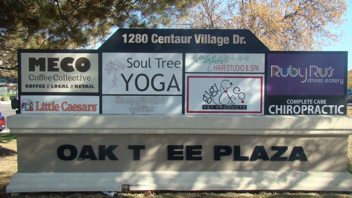 A sign displaying the bussiness of Oak Tree Plaza, very close to CHS. 