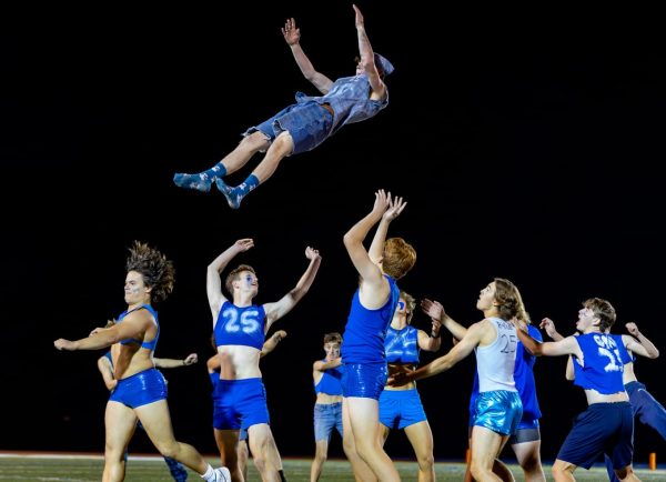 The Senior Powderpuff team performs their show at the Powderpuff football game.