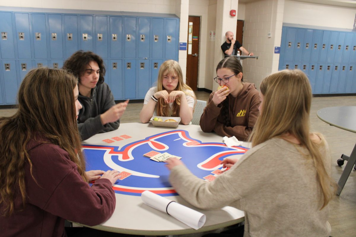 Students sit together at lunch following the new phone policy. 