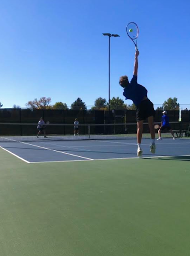 Member of The 25-26 Boy's Varsity Tennis Team On The Court