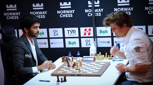 Magnus Carlsen (right) slams the table after a heartbreaking loss to Gukesh Dommaraju (left), Norway Chess Tournament 2025  - Chess.com
