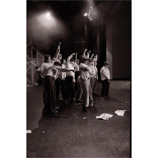 Newsies! actors on stage, Alex McGibbon November 2025